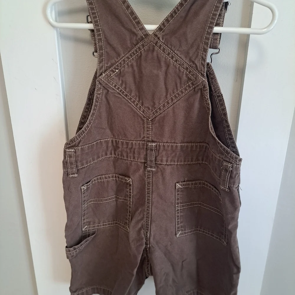 Gymboree Brown Shortalls – “Skateboard” Embroidered Pocket – Size 18-24 Months